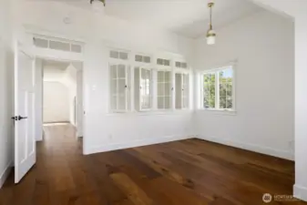 Office with amazing interior windows for light and heat thru transom.