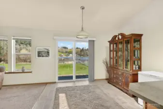 Spacious dining room off of kitchen with access to backyard.