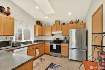 The kitchen has tons of cabinets and pantry! Endless storage space.