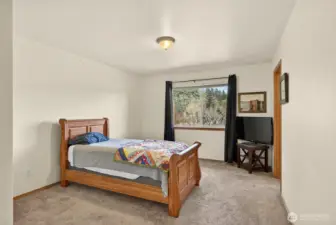 Primary bedroom with ensuite bathroom, large closet and gorgeous views of Sunday Lake.