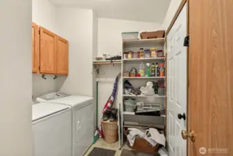 Huge laundry room with access to two car garage.