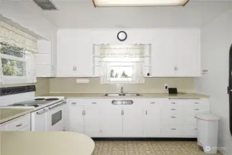 Drenched in natural light, this spacious kitchen offers plenty of counter space.