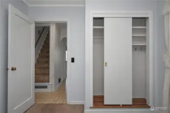 The additional bedroom's closet offers several storage options.