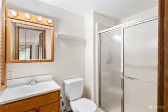 3/4 bathroom off family room/primary.