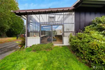 Grow your garden year around in this huge greenhouse space (approx. 40' x 16') with raised beds and lots of space for potting and tools.