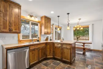 Great layout of the custom kitchen with dining space adjacent.