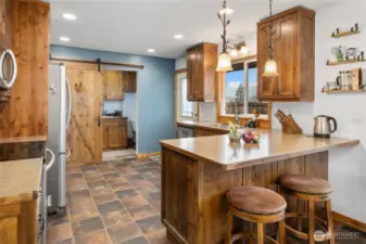 There is bar seating off the kitchen in addition to the dining space.