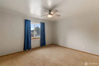 Bedroom towards the front of the home with  ceiling fan.