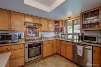Custom cabinetry, soft-close drawers, quartz, gas range, Bosch appliances, open plan...what more could you want?