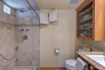 Primary bath has a very spacious walk-in shower with porcelain tile, solid stone base and plumbing for steam shower!