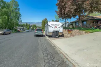 Owners spared no expense terracing the front to create an RV pad