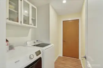 Washer/dryer with access to garage.