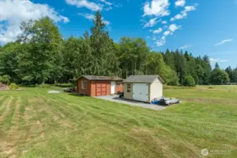Shed on the left is original, shed on the right is 2019 - great for storage, lawn tools, etc. This shed is from Costco & has a electrical box installed.