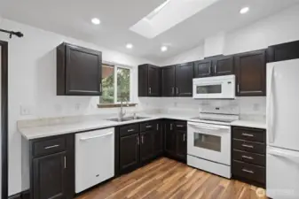 Updated kitchen with quartz countertops.