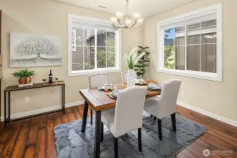 Light-filled dining room area accented with windows.
