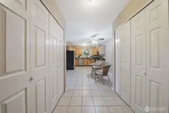 This is the view from the entry looking toward the kitchen. Notice all of the closet storage. The washer and dryer are in the closet on the left.