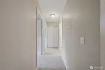 From the entry when you look staight ahead you see the hallway to the bedrooms with another storage closet at the end.