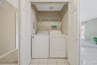 The washer and dryer are full size and can be closed off behing closet doors.