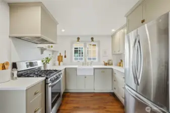 Bright, remodeled kitchen with a farmhouse sink and modern finishes.