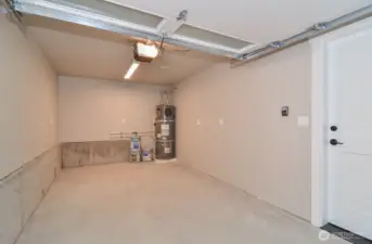 Finished single car garage with electric charger ready.