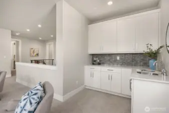 Upper level family room with bar and snack area. Perfect for game night!