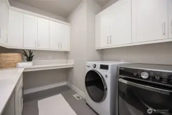 Wonderful cabinet space in this laundry room located on upper floor