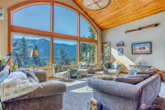 Incredible mountain & lake views from the carpeted main living area. Open floor plan with the dining area & kitchen make this an inviting space to entertain or unwind.