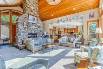Expansive main living room has cathedral ceilings, lots of light, & an open floor plan