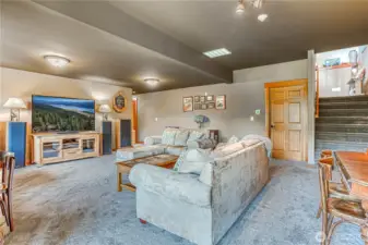 Large rec room just downstairs has plenty of room for games, puzzles, & movie watching. Great floorplan