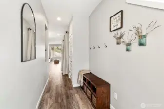 Bright entry hallway with updated flooring and clean, modern finishes throughout.