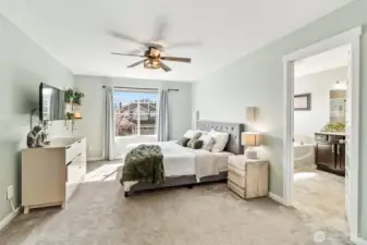 Expansive primary bedroom with abundant natural light.