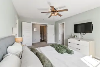 Primary suite with ensuite bath and walk-in closet access.