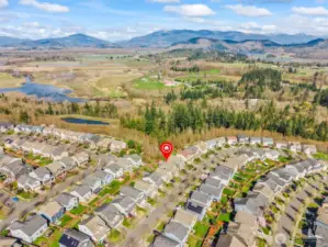 Aerial view of home within neighborhood setting.