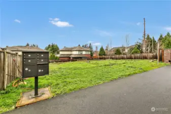 Vacant lot & secure mailboxes.