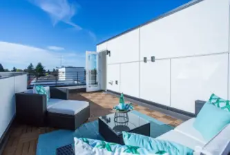 Ready for summer!  Composite decking + Cable TV hookups + lighting and privacy are just some of the features of this rooftop terrace amenity.