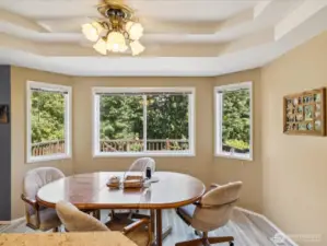 Eating area with elegant recessed ceilings.