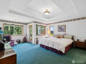 Primary Bedroom with elegant recessed ceilings.