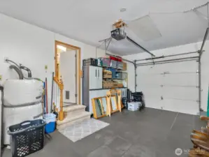 Garage is wide open space with Door to Backyard.