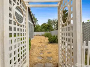 Expansive outdoor spaces with fully fenced Yard, Garden, Raised Beds & Outbuilding/Shed.