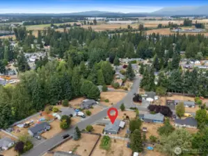 Drone view of the large corner lot and surrounding community.