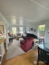 Living room with a great view of the gardens and fully fenced yard.