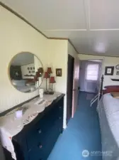 Main bedroom with view of the fully fenced yard and gardens.