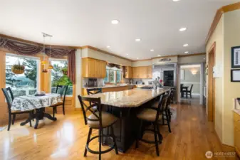 Kitchen has a breakfast nook, marble counter tops, sub zero fridge and Wolf Stove.