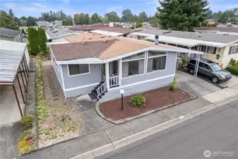 The large windows in this triple wide manufactured home bring in an abundance of natural light