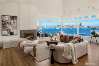 As you enter the great room you are immediately transfixed with soaring ceilings and commanding views of the Seattle skyline.