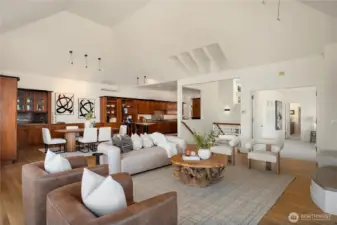 Looking across the massive living room towards the dining room and kitchen you can see some of the striking architectural details.
