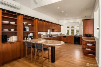 This enormous kitchen boasts great storage and counterspace, gas cooktop with separate wall oven and oversized sub-zero fridge.