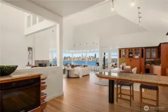Looking back from the kitchen towards the great room and view. The built-in wall oven is to the left.