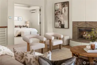 Just off the main living room is the sumptuous primary suite.
