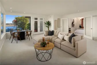 Looking across the rec room towards a bonus room which is set up as a non-conforming bedroom.
